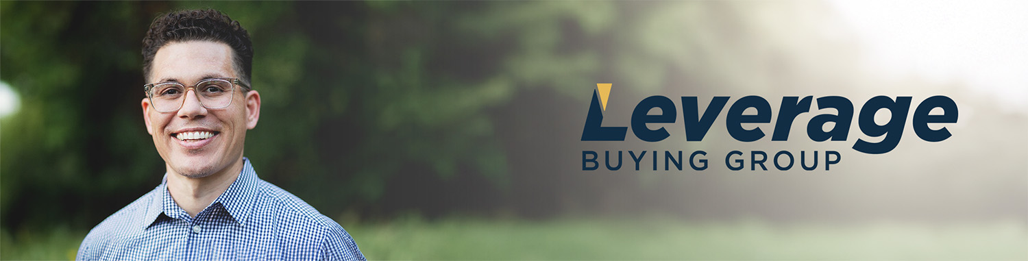 Man smiling at camera and beside leverage logo